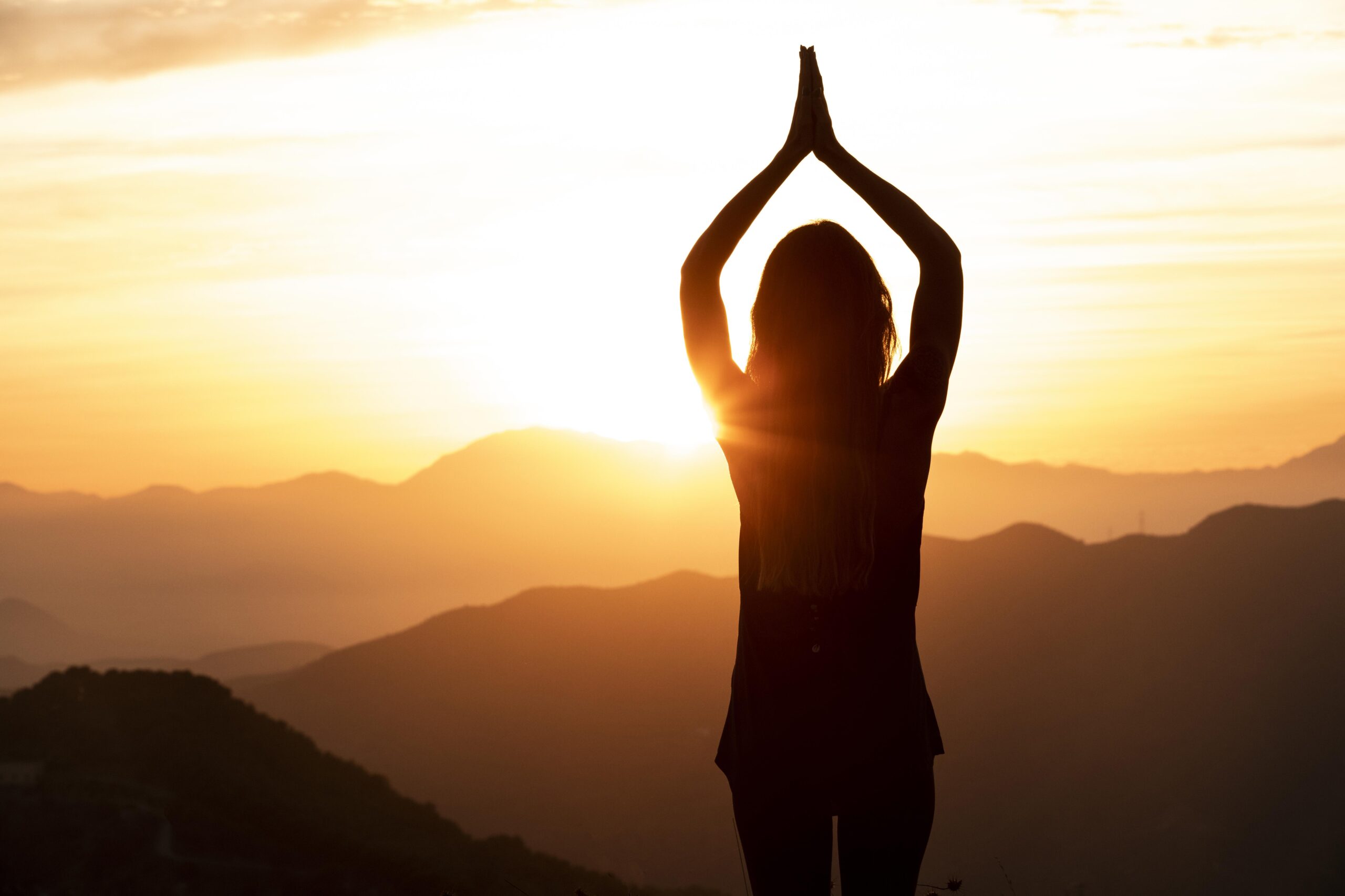 woman-sunset-doing-yoga